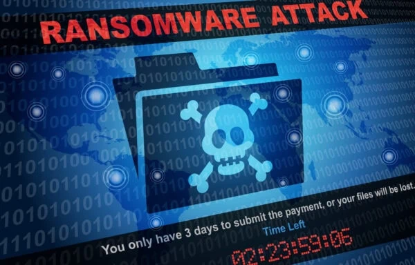 A digital illustration with "RANSOMWARE ATTACK" text, a skull and crossbones on a folder icon, binary code, and a message warning files will be lost if payment isn’t made in 3 days.