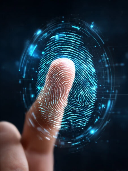 A close-up of a finger touching a digital interface, with a glowing fingerprint graphic and technological elements surrounding the finger.